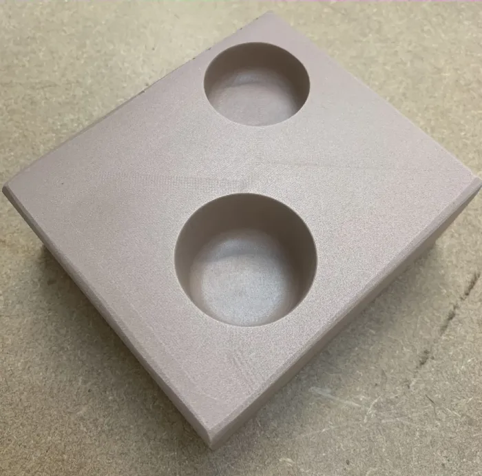 Stepped machining detail in turquoise tooling block