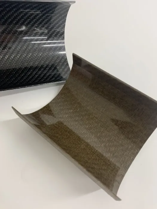 Carbon fibre sheet curling to show the twill weave