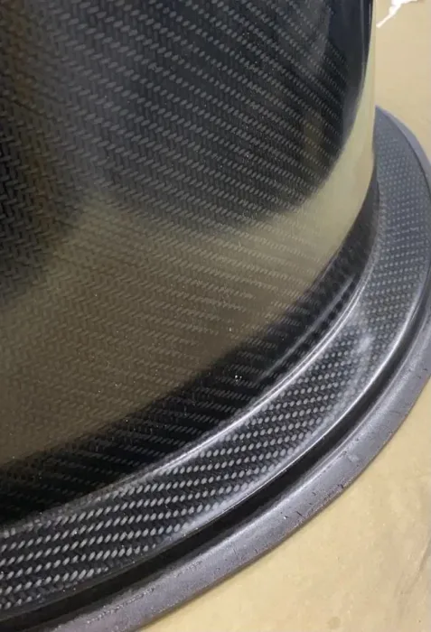 Close up of the gloss twill weave on a carbon fibre duct and its bonded flange ring