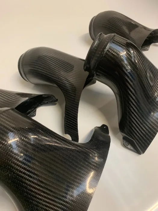 Group of gloss carbon fibre air intake ducts