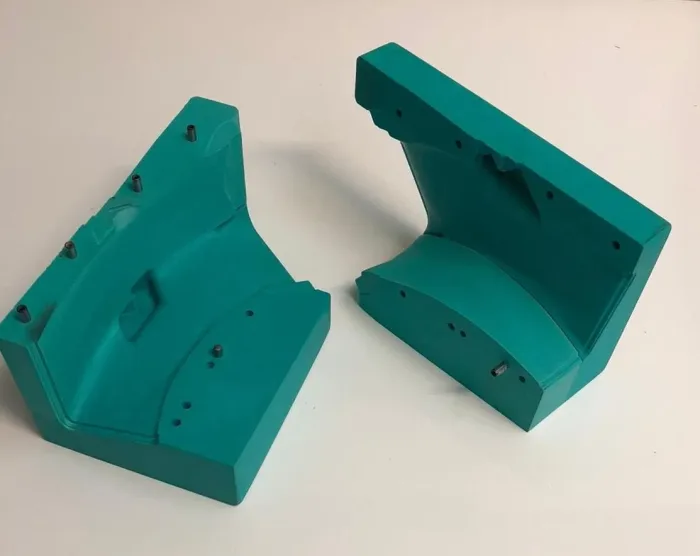 Pair of green machined tooling block patterns for a two part component